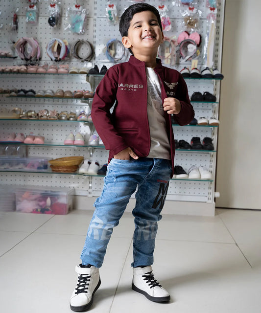 It is a maroon colour jacket with fancy white, round neck and half sleeve T-shirt for boys. This jacket comes with beautiful and stylish inscriptions and can be worn in school and gatherings.