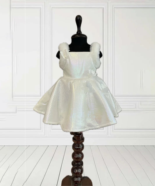 It’s a trendy cream coloured self-checked frock for kids that comes with a back closure. It features floral and cute butterfly detailing.