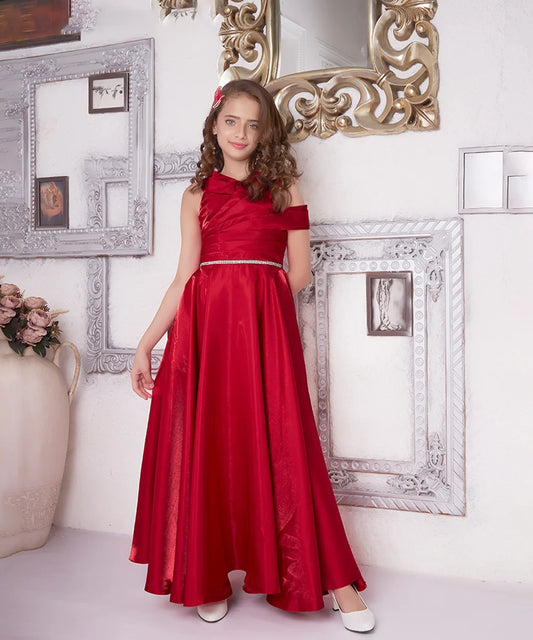 It’s a red coloured fancy gown with a back zip closure that comes with a matching inner making it a perfect children's birthday dress and a girl's wedding outfit. It features a beautiful belt detailing on the waist and pleated detailing on the yoke that uplifts the entire look.