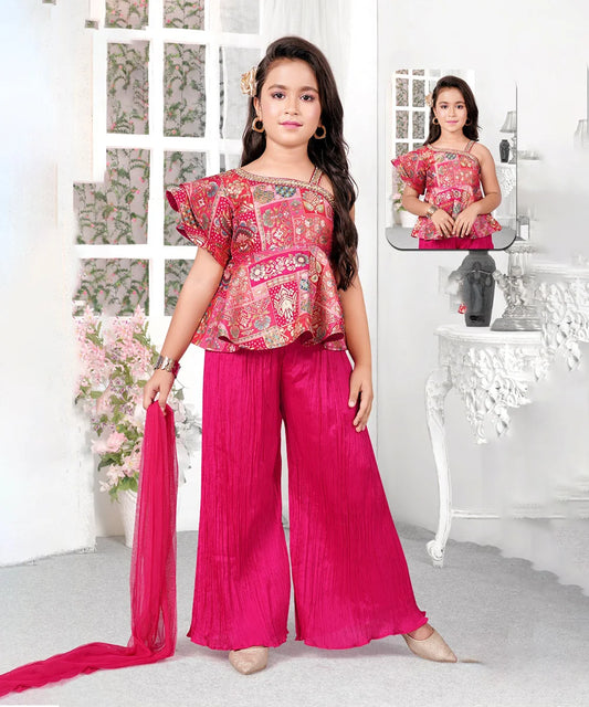 This rani pink coloured baby girl sharara suit consists of a peplum top with a back zip closure, a matching sharara and a dupatta. It features an embellished neck and tassels on the dupatta.