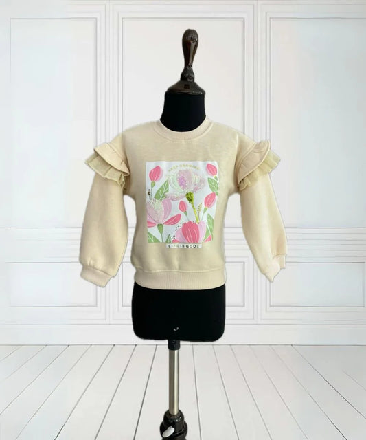 It is a beige Colored sweatshirt that has a printed detailing on it and is enhanced with sequin work.
