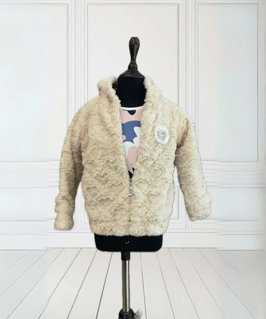  It is a smart Cream Colored winter Jacket for baby girls that comes with a small patch detailing on it.