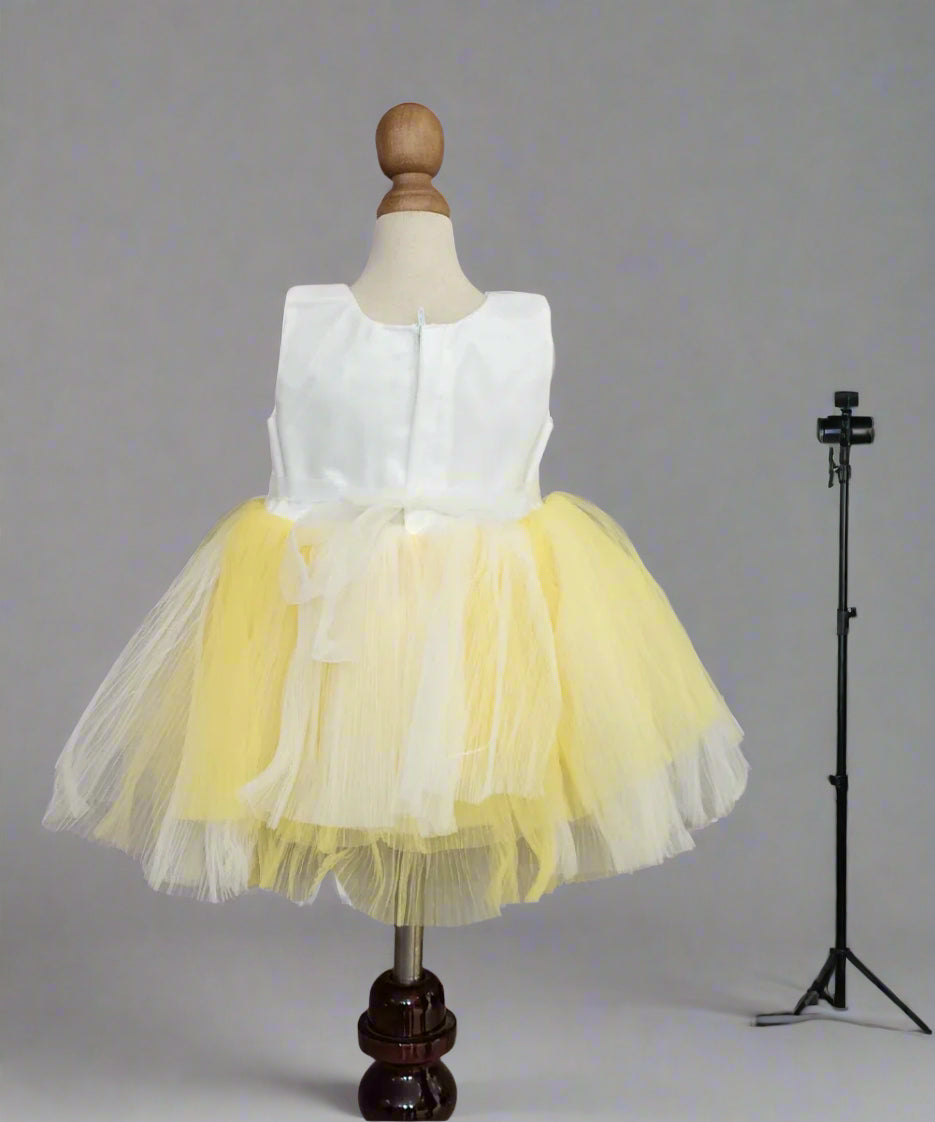 back view of white yellow frock for baby girls