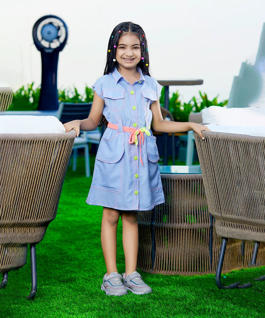  It is a beautiful light blue coloured shirt dress for girls. It features pockets and a funky-coloured tie-up belt around the waist.