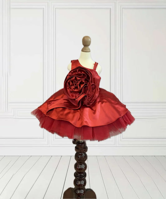 It’s a Red Riding Hood princess frock for kids with a back closure for birthday parties and weddings. It features beautiful big rose detailing that elevates the entire look and comes with a fabric belt to be tied at the back. 