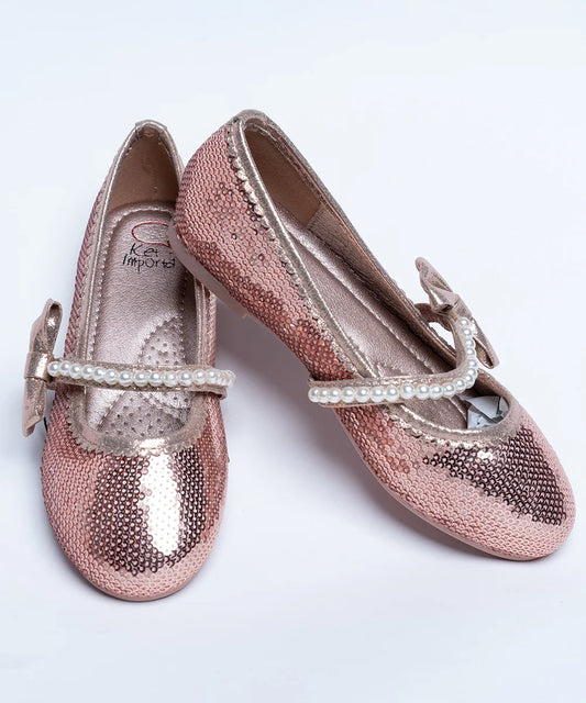  It's a pair of rose-gold Colored party-wear sandals for wedding parties. It features Patterned synthetic outsole, pearl and bow detailing on the belt.