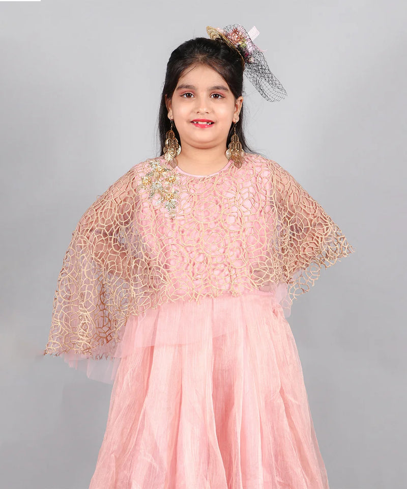 This light pink gown is paired up with a fancy golden Colored cape and comes with a back zip closure. It features embroidered detailing on the cape and fabric belt to be tied at the back.