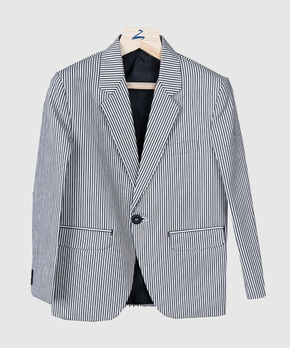 It is a classic formal black and white striped party blazer for boys. It features one-button fastening and pockets on both the sides