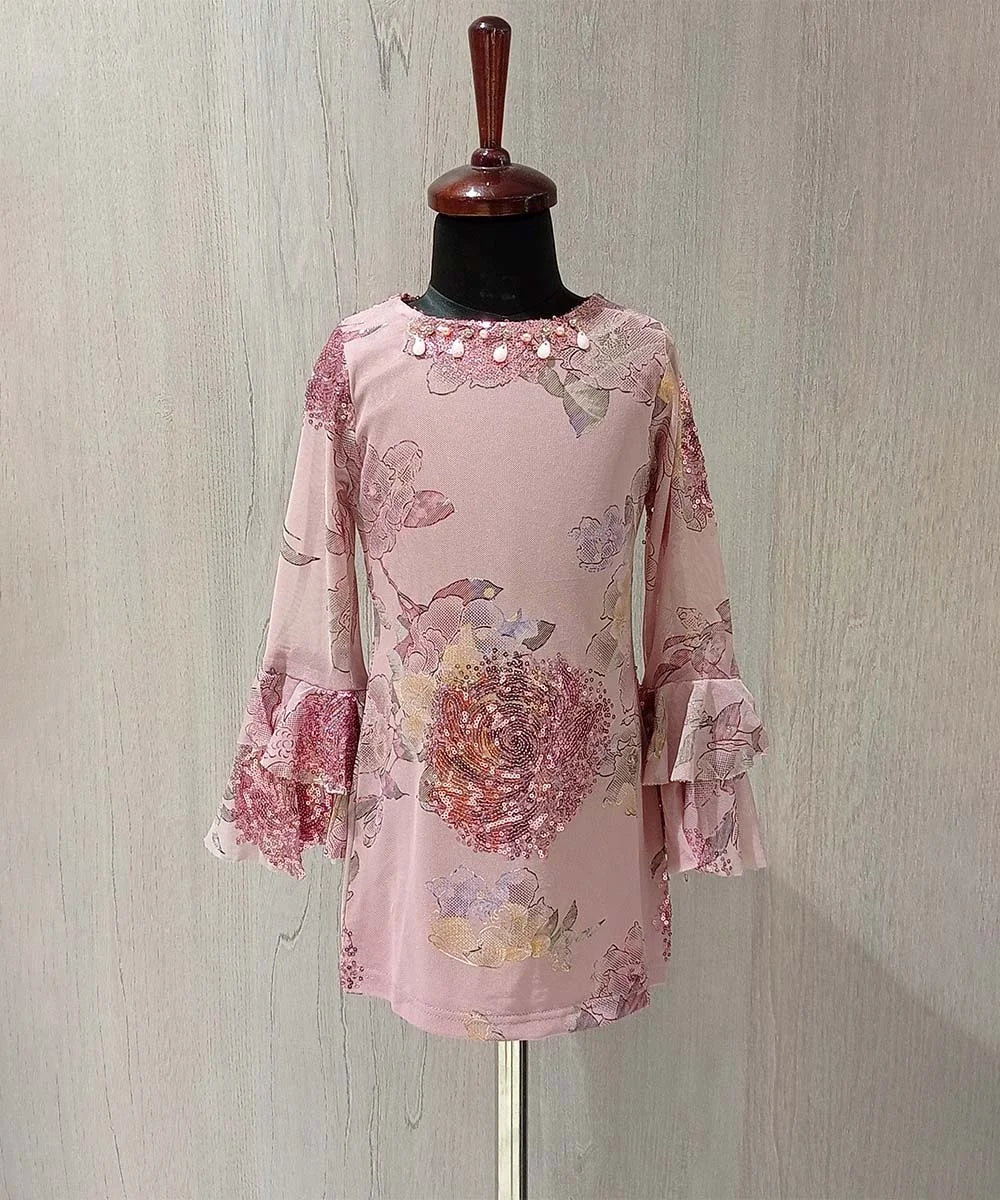 It is a onion pink Colored straight-fit printed dress that comes with a back zip closure. It features sequin work on the dress with some work detailing on the neck.