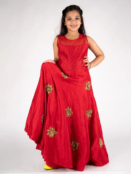 This is a red gown paired up with short sleeves that can be stitched as per requirement and comes with a back zip closure. It features Golden sequin and floral work detailing and comes with the fabric belt to be tied at the back.