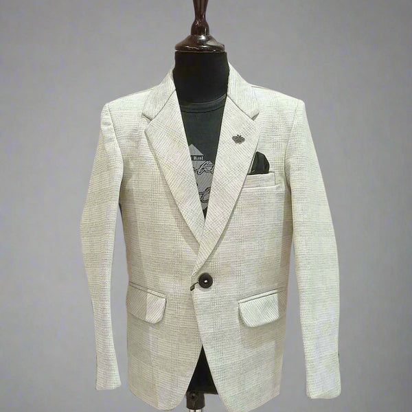 It is elegant light colored check textured blazer that comes with a cool black round neck half sleeve t-shirt. This silhouette features one-button fastening, a cute broach on the peak lapel collar and a pocket square. 