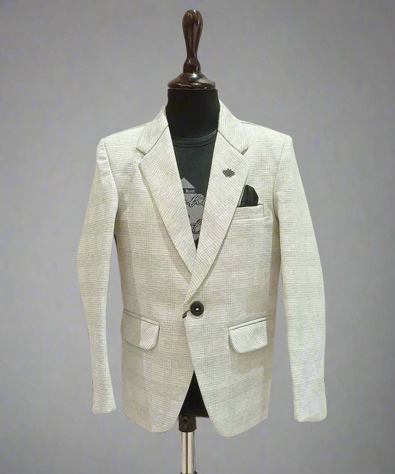 It is elegant light colored check textured blazer that comes with a cool black round neck half sleeve t-shirt. This silhouette features one-button fastening, a cute broach on the peak lapel collar and a pocket square. 