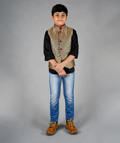 It is a beautiful beige color party wear waist coat set for boys. The entire set consists of a cut sleeved waistcoat jacket with a black Color Shirt. It does not have a pant.