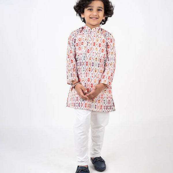 It is a beautiful Patola printed cotton kurta with Nehru collar teamed up with off White Pajama for boys.
