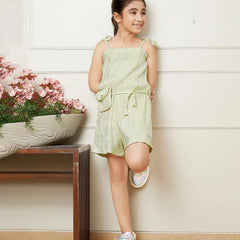 It is a beautiful Pista green Colored jumpsuit with an elasticated waist and shimmer dots all over the dress with a cute neck detailing. It comes with a matching belt and a mini purse.