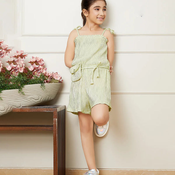 It is a beautiful Pista green Colored jumpsuit with an elasticated waist and shimmer dots all over the dress with a cute neck detailing. It comes with a matching belt and a mini purse.