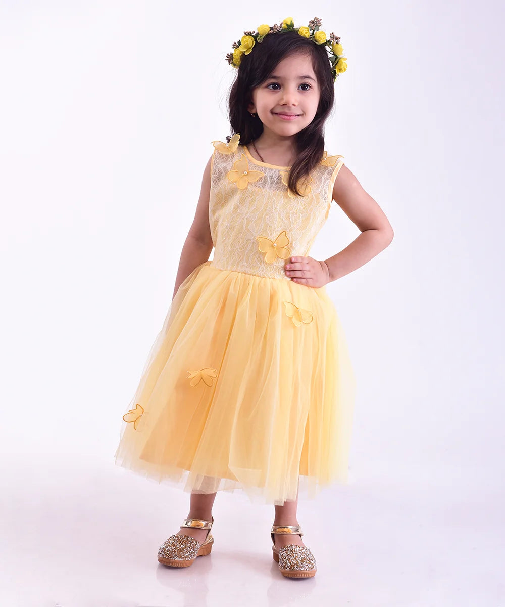  It’s a yellow Colored frock that features butterfly applique work with pearl detailing on it. Moreover, it comes with a pair of matching short sleeves that can be stitched as per requirement.