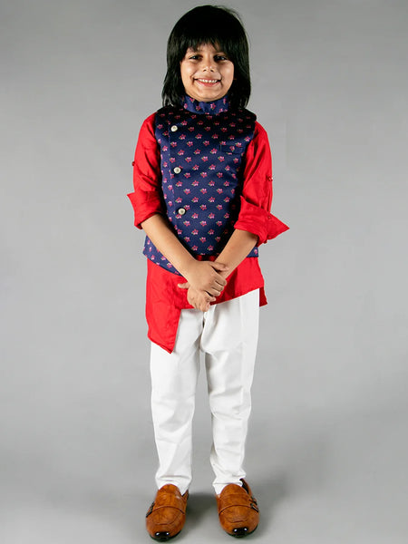 It is a beautiful navy printed Jacket with solid red asymmetric Kurta and White Pajama for boys. It consists of a full sleeved Kurta with a sleeveless Jacket along with a matching Salwar.