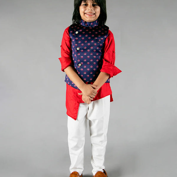 It is a beautiful navy printed Jacket with solid red asymmetric Kurta and White Pajama for boys. It consists of a full sleeved Kurta with a sleeveless Jacket along with a matching Salwar.
