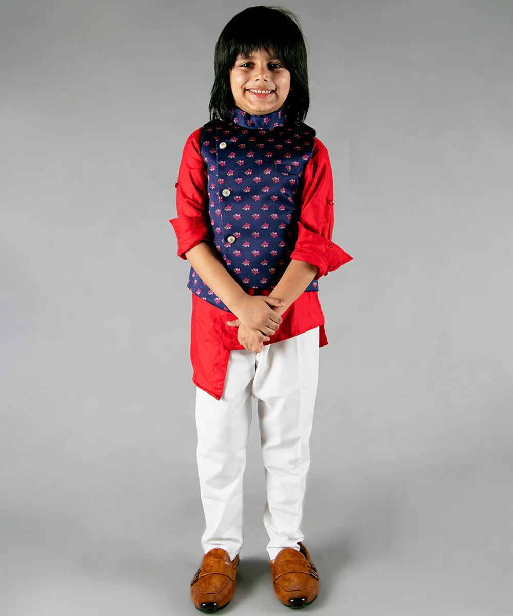 It is a beautiful navy printed Jacket with solid red asymmetric Kurta and White Pajama for boys. It consists of a full sleeved Kurta with a sleeveless Jacket along with a matching Salwar.