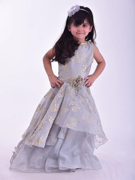 It is a beautiful grey Coloured stylish gown for girls that comes with a back zip closure. It features floral embroidery detailing on the dress and comes with a fabric belt to be tied at the back.