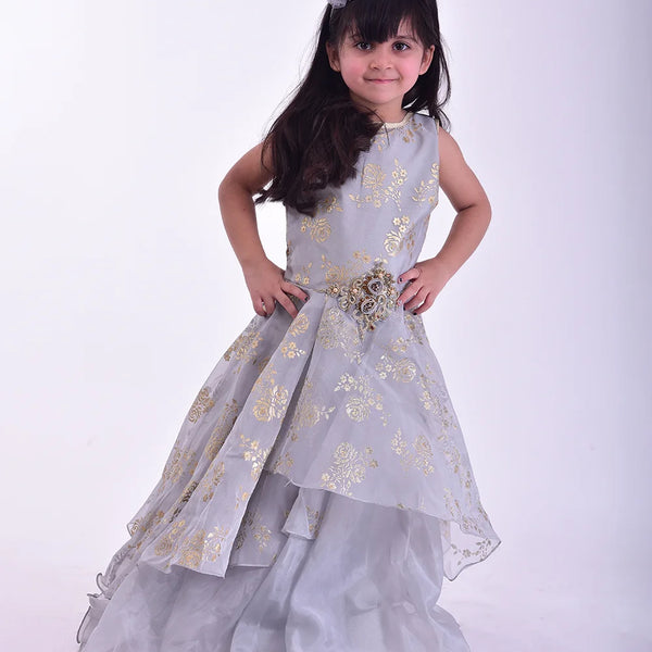 It is a beautiful grey Coloured stylish gown for girls that comes with a back zip closure. It features floral embroidery detailing on the dress and comes with a fabric belt to be tied at the back.