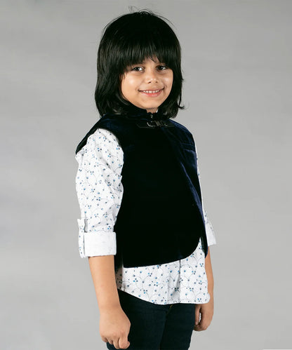 It is a beautiful navy blue Colored velvet waistcoat with a printed white Shirt for boys. It does not have a pant. The jacket is curated from a velvet fabric giving it a smart look. I