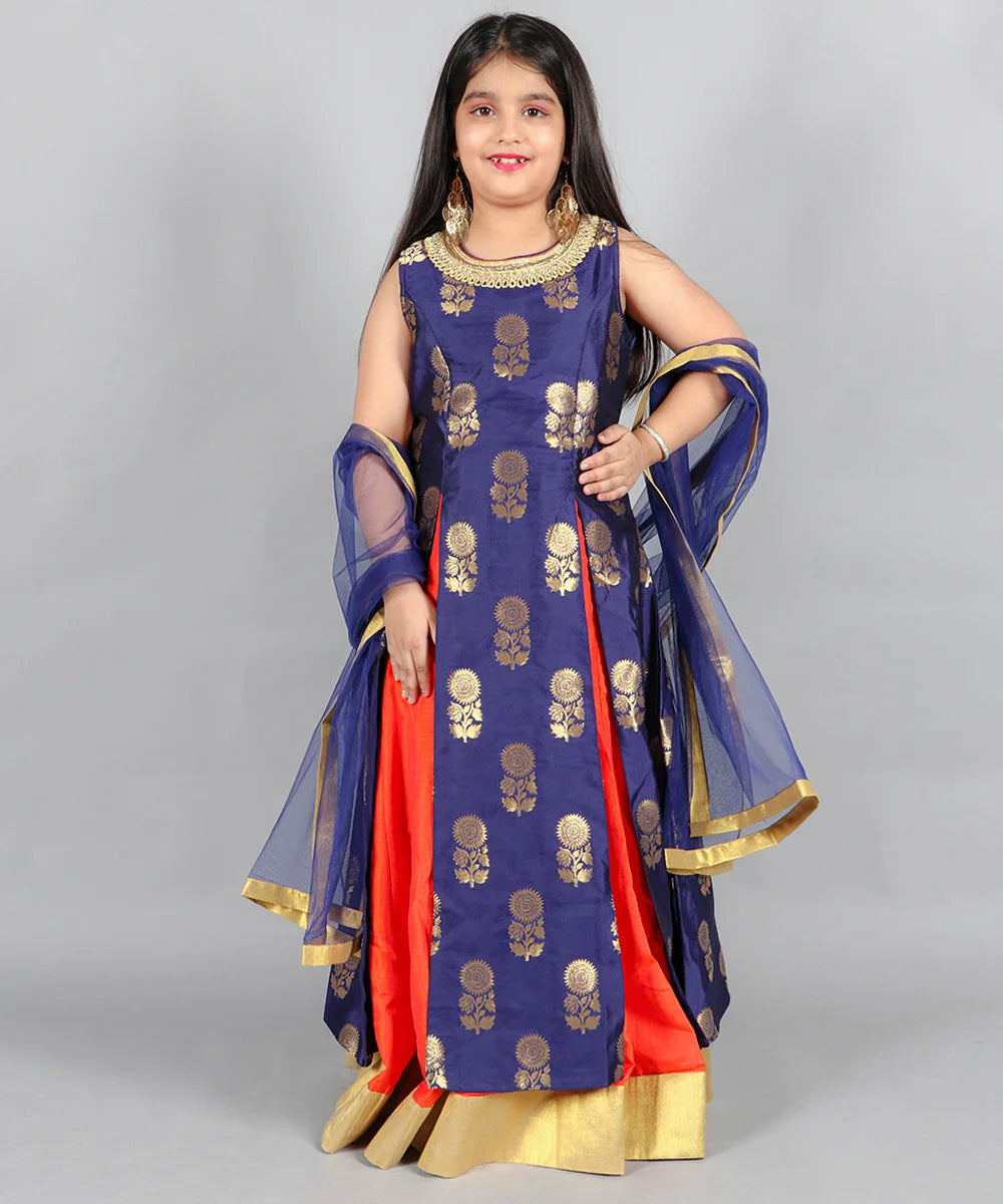 This blue and orange outfit consists of a long-slit kurta, a skirt and a dupatta. It features a beautiful lace work on the neck of the kurta.