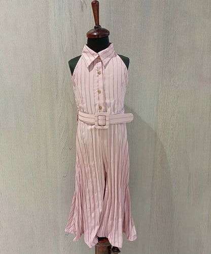 It is a pink-colored self-striped jumpsuit for girls perfect for summer days. It comes with a matching self-striped belt.