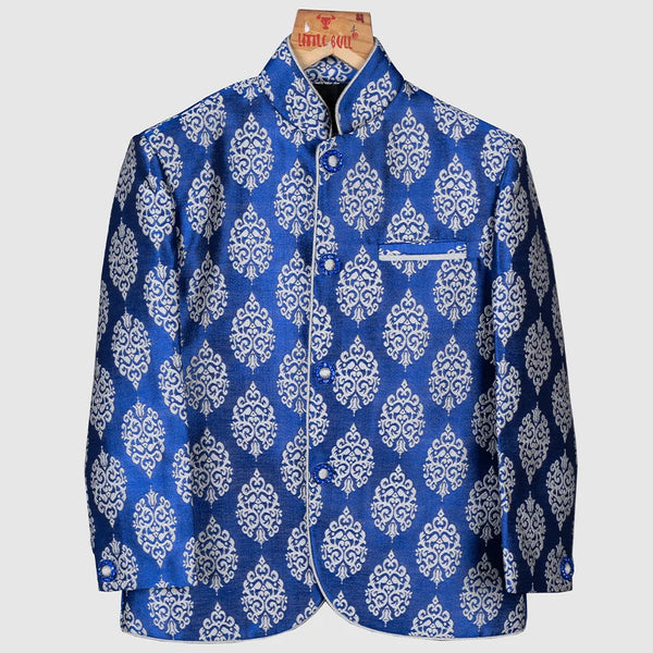 This classic blue colored Jodhpuri suit is curated from high quality brocade fabric. It comes along with pajama for boys.