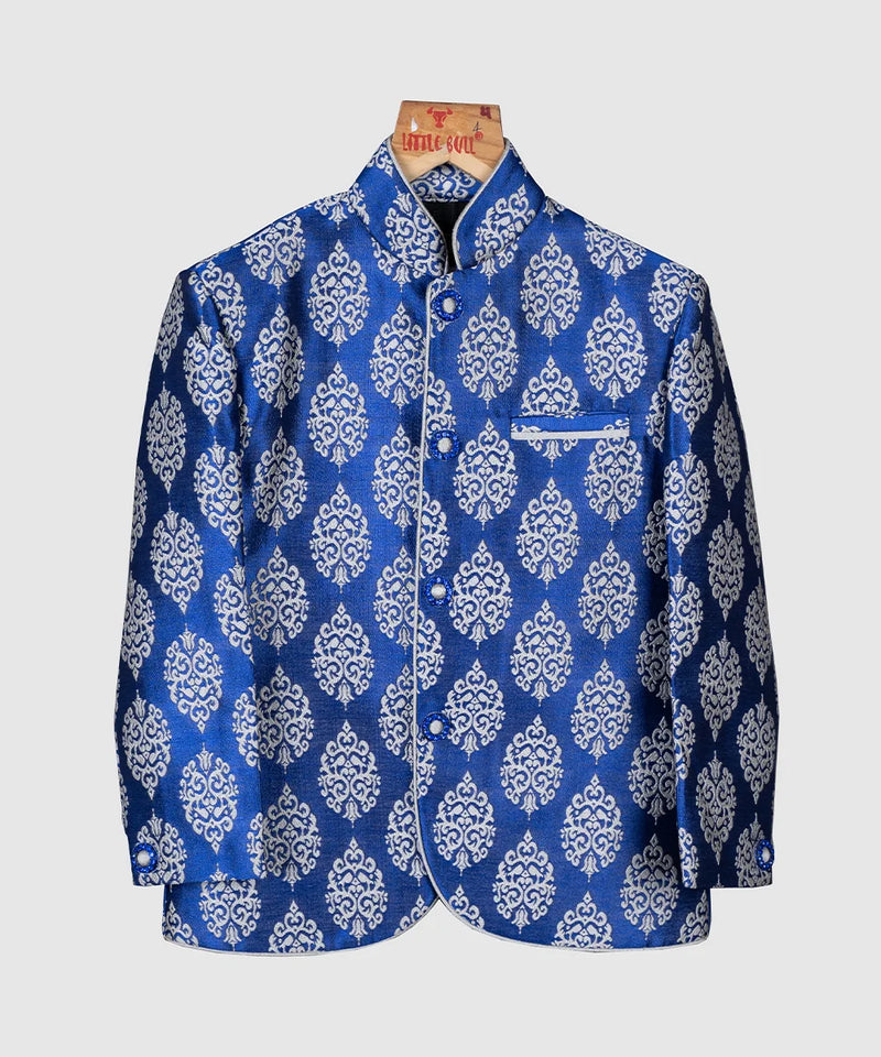 This classic blue colored Jodhpuri suit is curated from high quality brocade fabric. It comes along with pajama for boys.