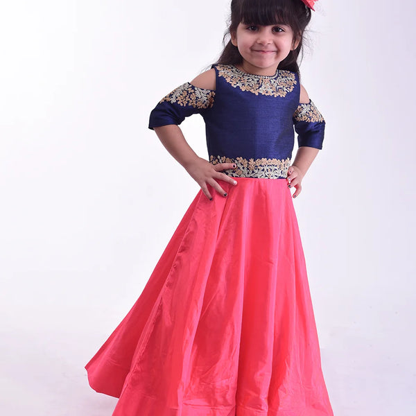 It’s a pink and blue party gown that comes with the back zip closure. It features floral embroidery detailing on the dress and comes with fabric belt to be tied at the back.