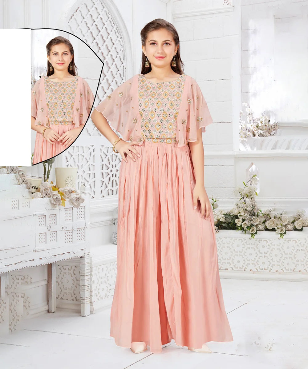 This peach Colored party dress consists of a fancy top that comes with a back hook closure and a matching palazzo. It features embroidered detailing on the top as well as on the waist of palazzo.
