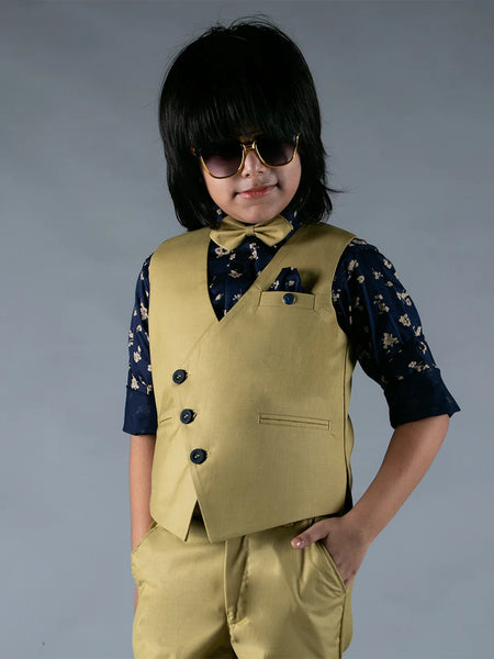 It is a beautiful light green Color party wear waist coat Set for boys. It comes with a navy blue colored printed shirt, a pocket square, a bow and a matching light green colored pant.