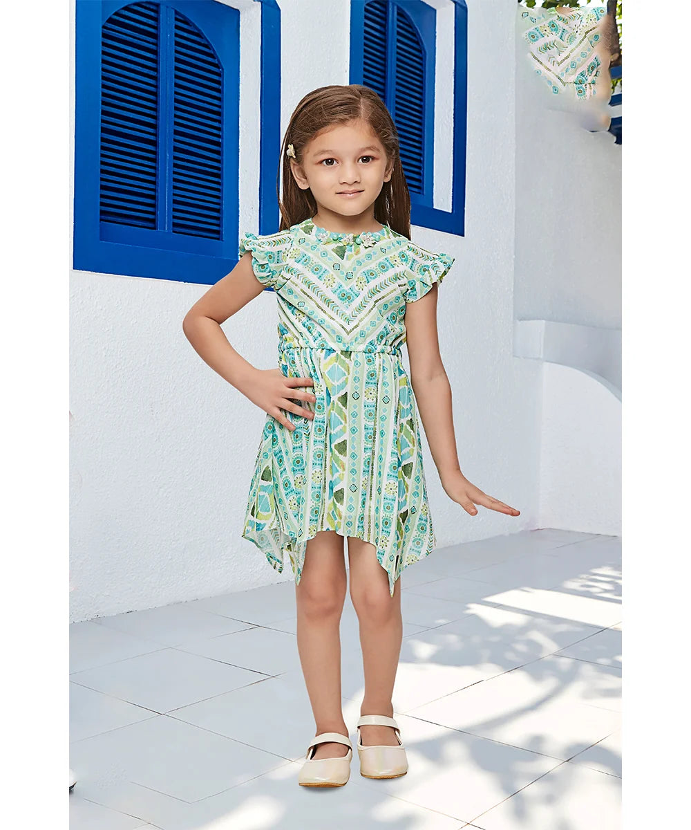 It is a green and white Colored printed dress that comes with an elasticated waist and back zip closure. It features flower and pearl detailing on the neck and comes with a matching white belt.