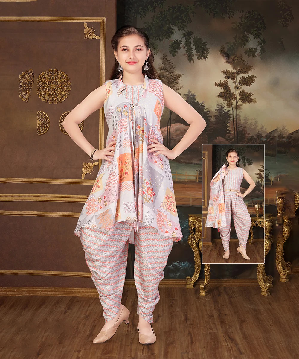 This grey dress consist of a beautiful crop-top with the back hook closure and a dhoti perfect for party looks. It features dori with tassels on shrug and comes with a basic short sleeves that can be stitched as per requirement.