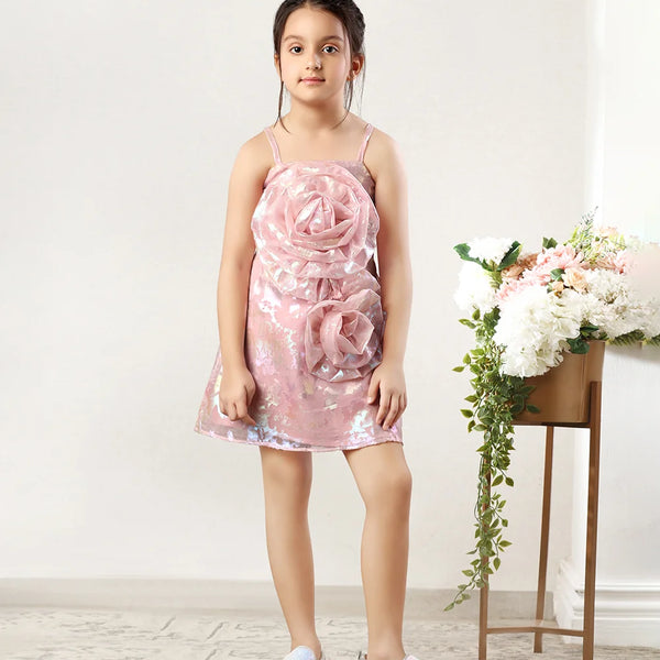 It’s a light pink coloured little girl wedding dress with beautiful big flowers attached to it to add elegance to the look.