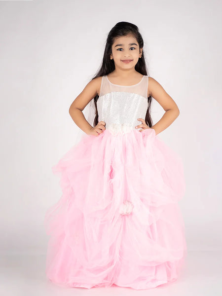 This pink and white Colored gown comes with the back zip closure. It features floral work detailing on the waist and the skirt part. Moreover, it also has a fabric belt to be tied at the back.