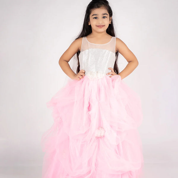 This pink and white Colored gown comes with the back zip closure. It features floral work detailing on the waist and the skirt part. Moreover, it also has a fabric belt to be tied at the back.