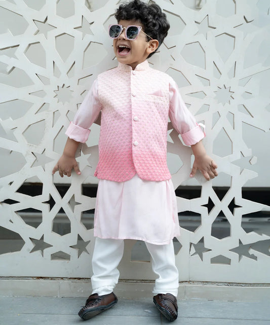Crafted from Muslin material, it features a full-sleeved light pink colored kurta teamed up with a matching off-white pajama, enhanced by the ombre pink embroidered jacket. Moreover, the sleeveless jacket comes with a stand collar neckline and a pocket square.