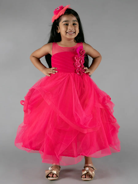 It’s a pink party gown for kid girl that comes with the back zip closure. It features floral as well as feather work on the dress and comes with the fabric belt to be tied at the back.