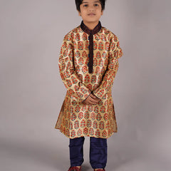  It is a full sleeve beige Colored traditional kurta for boys paired up with a navy blue Colored pyjama. This kurta curated from raw silk fabric features mandarin collar and placket curated from thread detailing done on velvet fabric while the pyjama features an elasticated waist to keep him at ease.