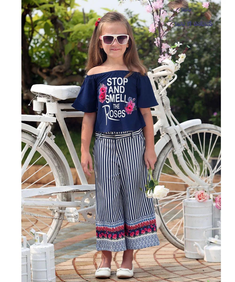  It Consists of a Navy and white Colored top and pants for little girl. This dress has floral and printed detailing on it that adds grace to the look.