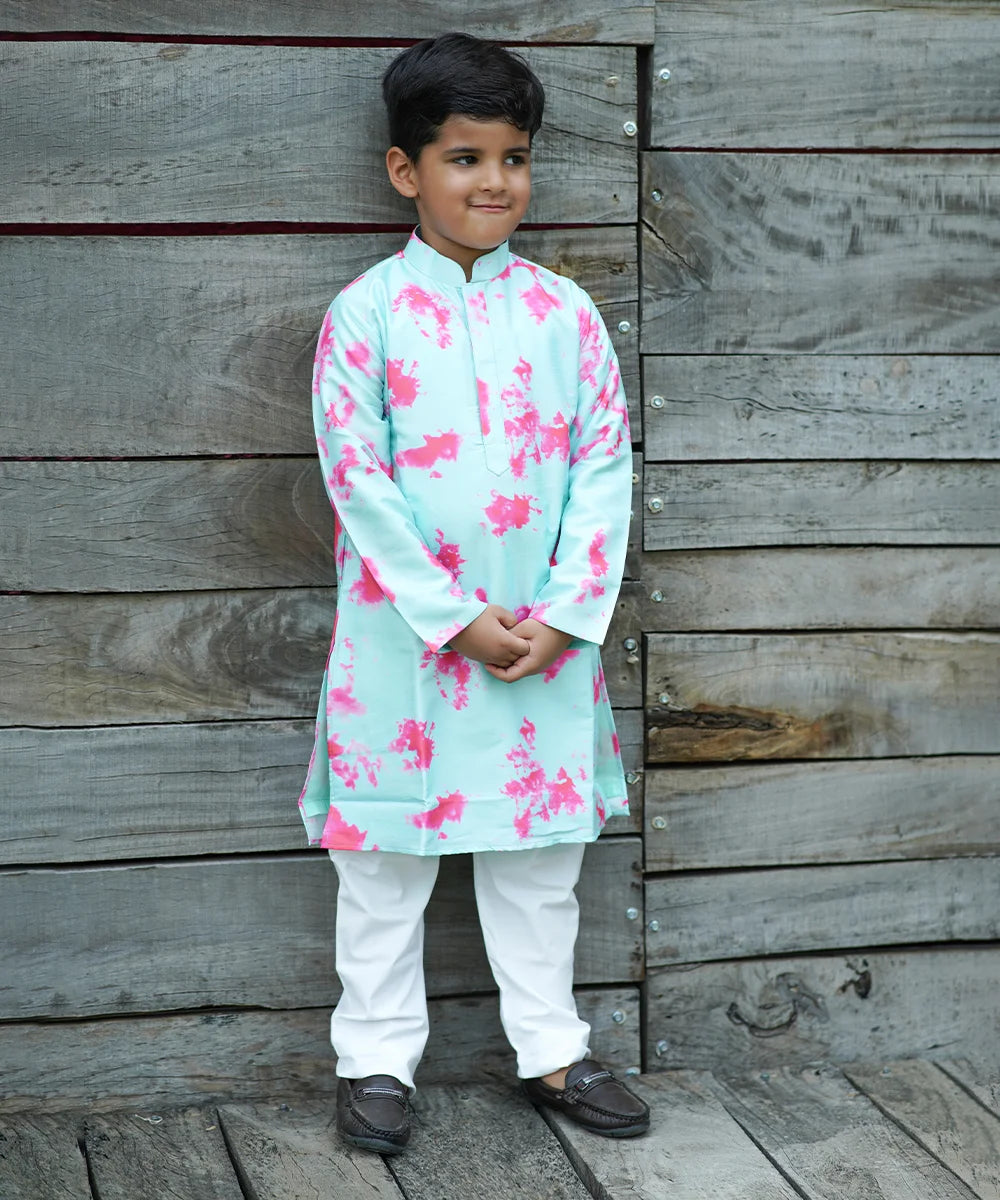 It's a beautiful full sleeved tie and dye kurta in light sea green colour and is paired up with a matching white coloured Pyjama. 