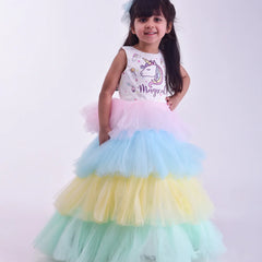 It’s a beautiful ruffle layered gown that comes with the back zip closure. Moreover, it is paired up with short sleeves that can be stitched as per requirement. It features digital print of unicorn and the fabric belt to be tied at the back.