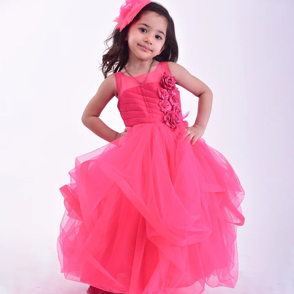 It’s a pink party gown for kid girl that comes with the back zip closure. It features floral as well as feather work on the dress and comes with the fabric belt to be tied at the back.