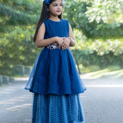 It’s the blue Colored gowns for kids that comes with the back zip closure. Moreover, it is paired up with short sleeves that can be stitched as per requirement. It features embroidery work on the waist, the fabric belt to be tied at the back and a self-embroidered fabric.