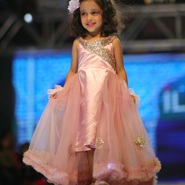 This pink gown comes with a net trail and a back zip closure. It features sequin work on the dress and applique work on trail. Also, it has a fabric belt to be tied at the back.