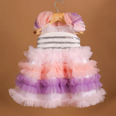 It's a frilly frock with a back zip closure that features sequin lace on the dress with lots of frill detailing.