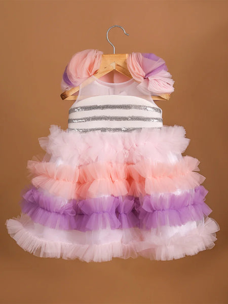 It's a frilly frock with a back zip closure that features sequin lace on the dress with lots of frill detailing.